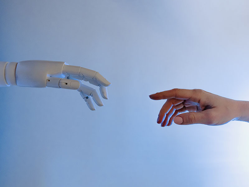 Robot hand reaching to human hand 