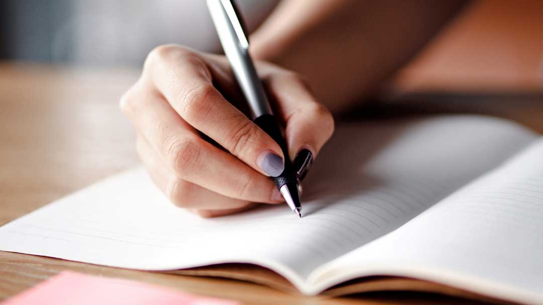 Writing in a lined book