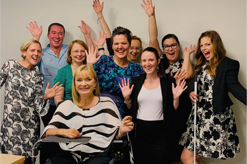 group of persons with hands up in air