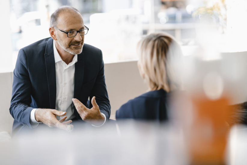 two persons in conversation