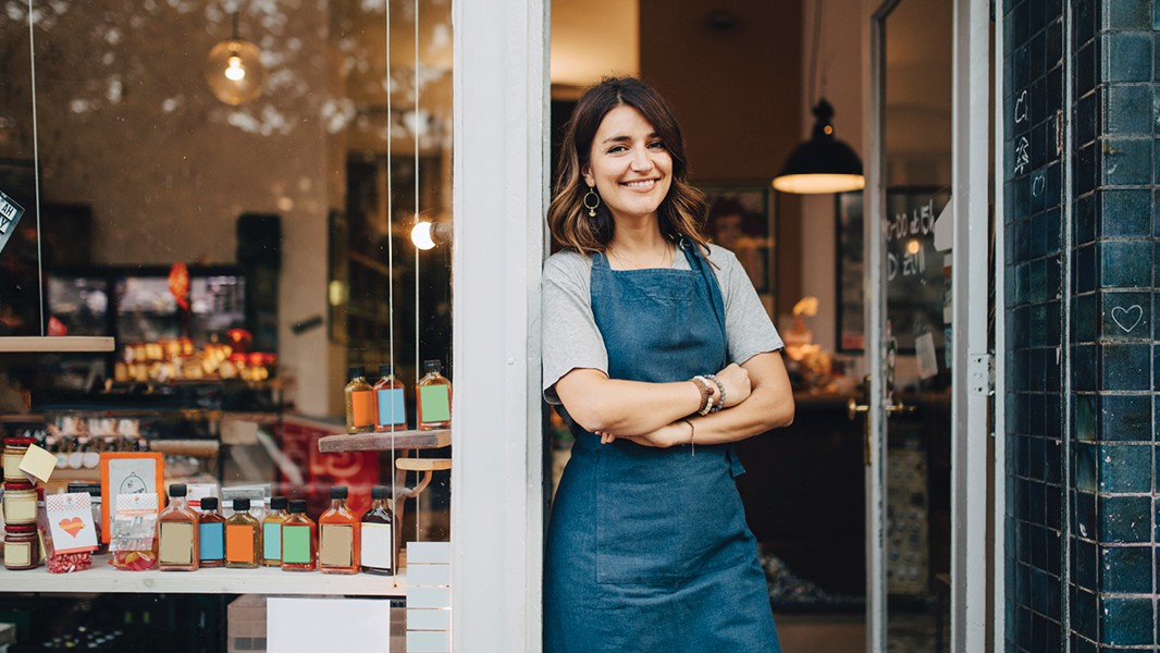 This is a picture of a woman standing in front of her shop