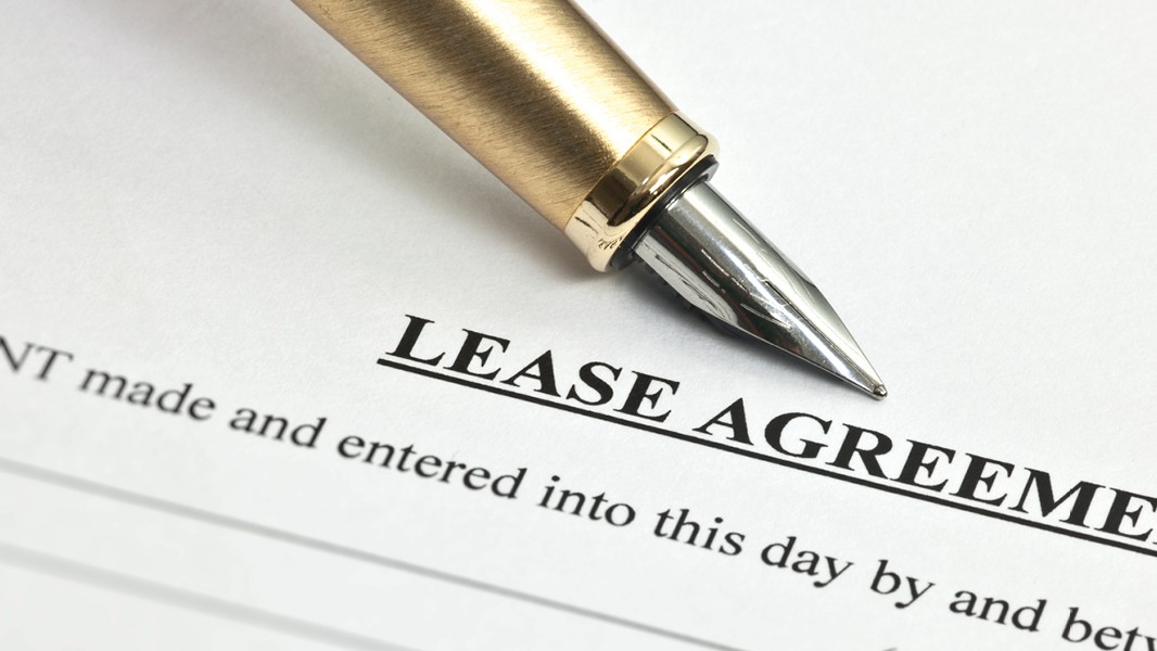 This is a picture of a piece of paper with the words lease agreement on it