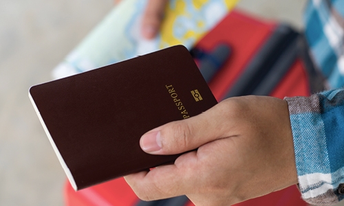 A picture of a person holding a passpost