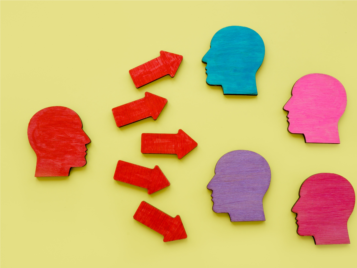 Graphic with Heads and Arrows Conveying Persuasion